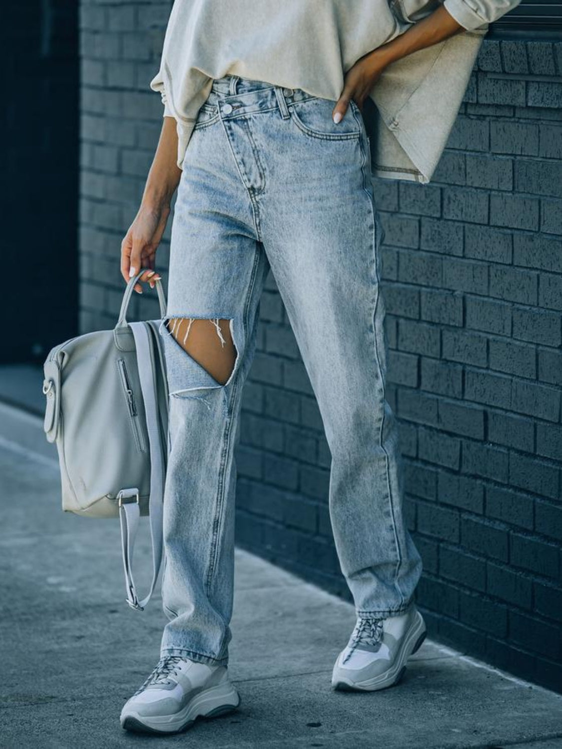 Distressed Asymmetric Waist Jeans - The Goddess Galleries