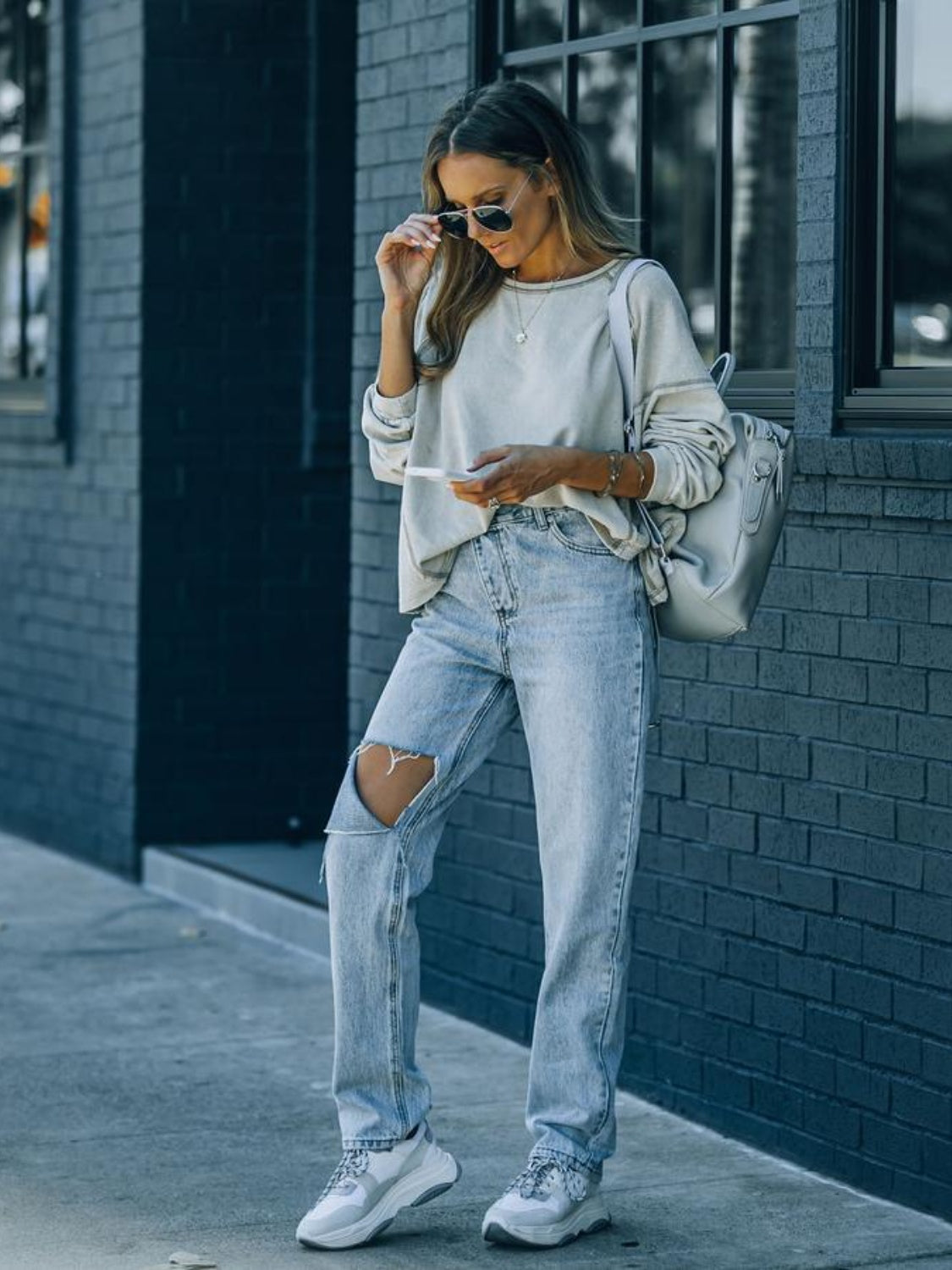 Distressed Asymmetric Waist Jeans - The Goddess Galleries