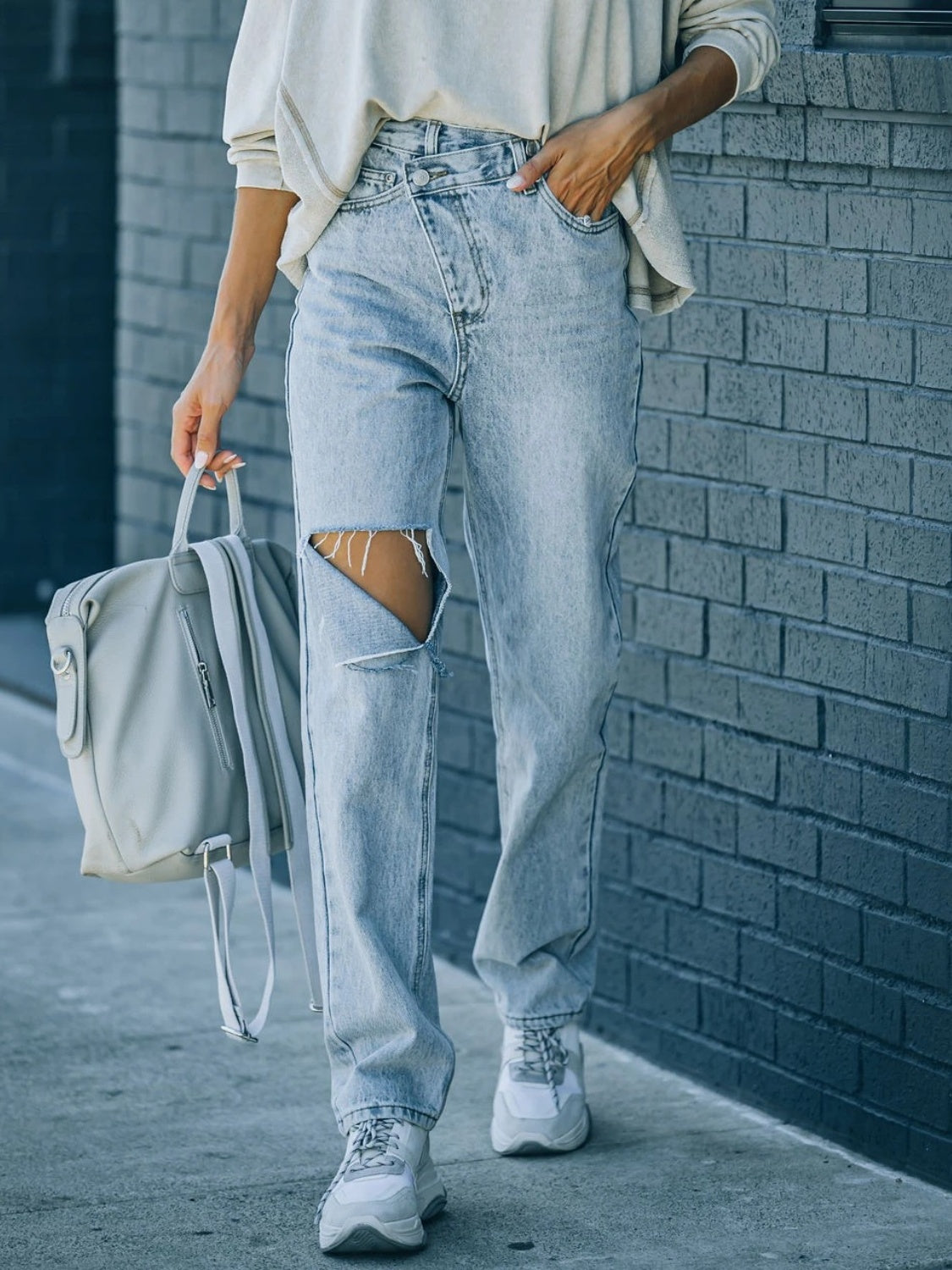Distressed Asymmetric Waist Jeans - The Goddess Galleries